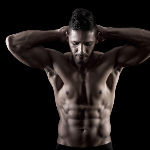 muscled man on a black background