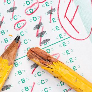 A graded test form with red scoring pencil marks